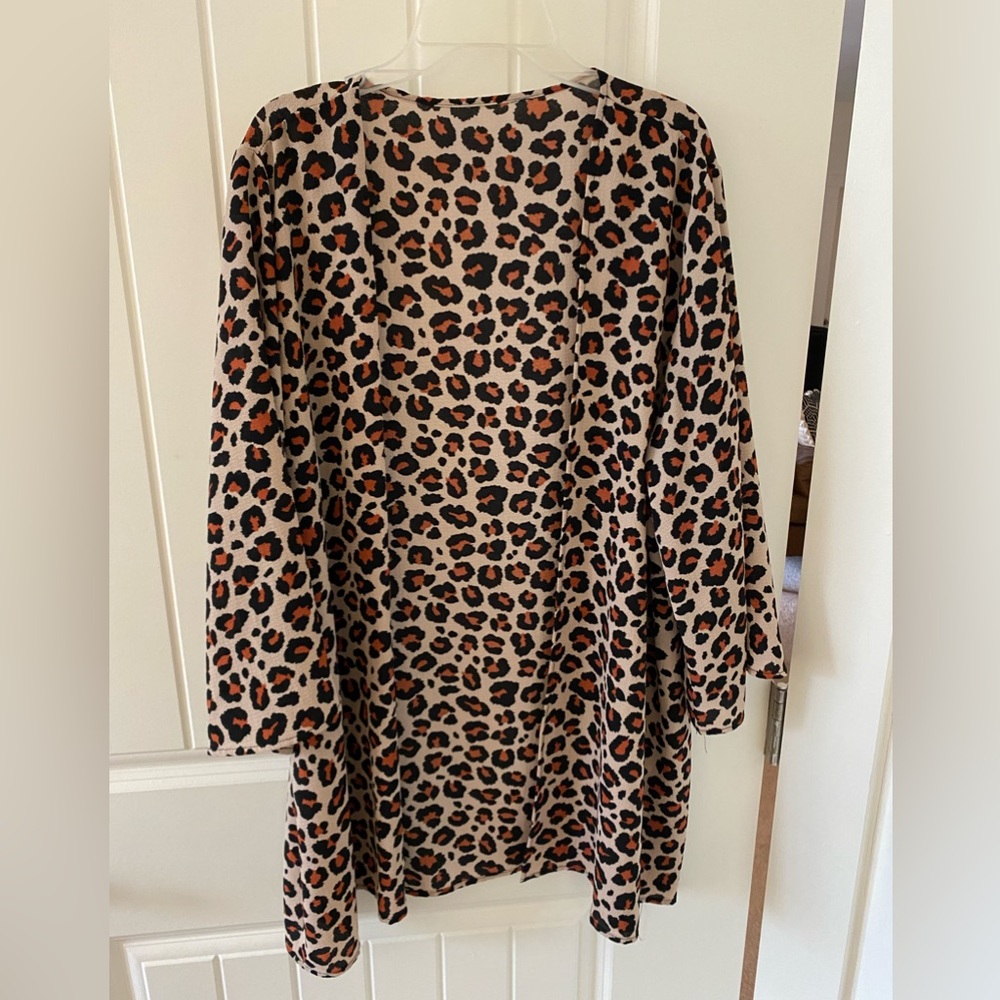 Leopard Cover.. Flowy… Perfect with a black dress. Size M 1/4 length sleeve